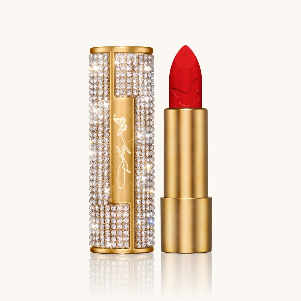 <p><a href="https://dollybeauty.com/products/heavens-kiss-lipstick?variant=43830194274357" rel="nofollow noopener" target="_blank" data-ylk="slk:Shop Now;elm:context_link;itc:0;sec:content-canvas" class="link ">Shop Now</a></p><p>Heaven’s Kiss Lipstick in Jolene Red</p><p>dollybeauty.com</p><p>$20.00</p>