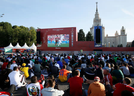 Soccer Football - World Cup - Group B - Morocco vs Iran - Moscow, Russia - June 15, 2018. Supporters watch the match in a fan zone near the main building of the Lomonosov Moscow State University. REUTERS/Gleb Garanich