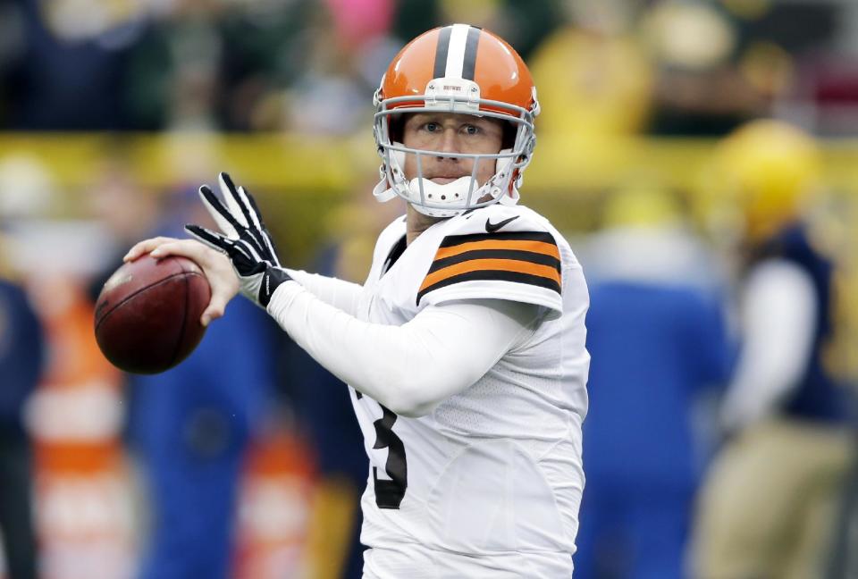 FILE - In this Oct. 20, 2013, file photo, Cleveland Browns' Brandon Weeden warms up before an NFL football game against the Green Bay Packers in Green Bay, Wis. Browns have released quarterback Weeden. (AP Photo/Tom Lynn, File)