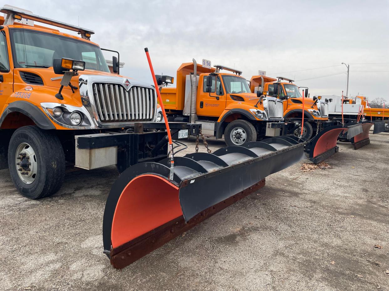 Illinois Department of Transportation trucks, with snowplows attached, stand at the ready Friday at IDOT's West Yard in Springfield.