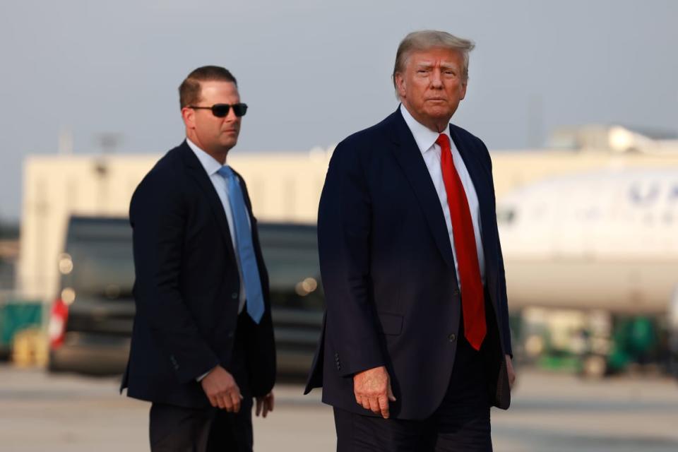 Former President Donald Trump arrives at Atlanta Hartsfield-Jackson International Airport.