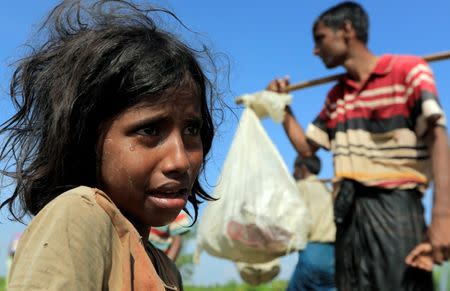 A Rohingya refugee girl who fled from Myanmar cries because she lost her mother, as they make their way after crossing the border in Palang Khali, near Cox's Bazar, Bangladesh October 16, 2017. REUTERS/ Zohra Bensemra