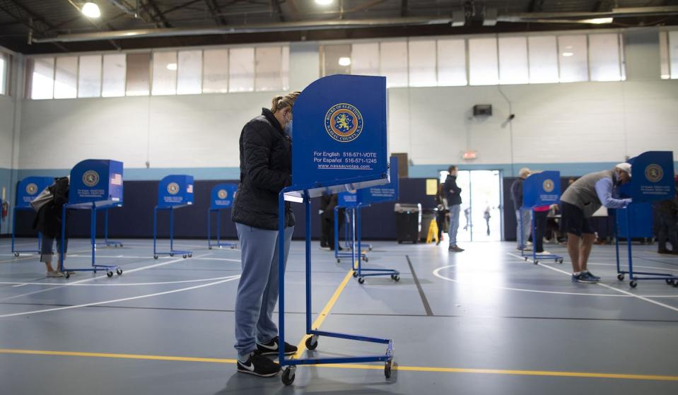 Voters in Garden City, New York, vote in October 2020. <a href="https://media.gettyimages.com/id/1284810362/photo/early-voting-booth-in-nassau-county-new-york.jpg?s=1024x1024&w=gi&k=20&c=u6UksNYbIqqwN8dQxcsXn00wqi7f2czC53Zb79jhBJ0=" rel="nofollow noopener" target="_blank" data-ylk="slk:Chris Ware/Newsday via Getty Images;elm:context_link;itc:0;sec:content-canvas" class="link ">Chris Ware/Newsday via Getty Images</a>