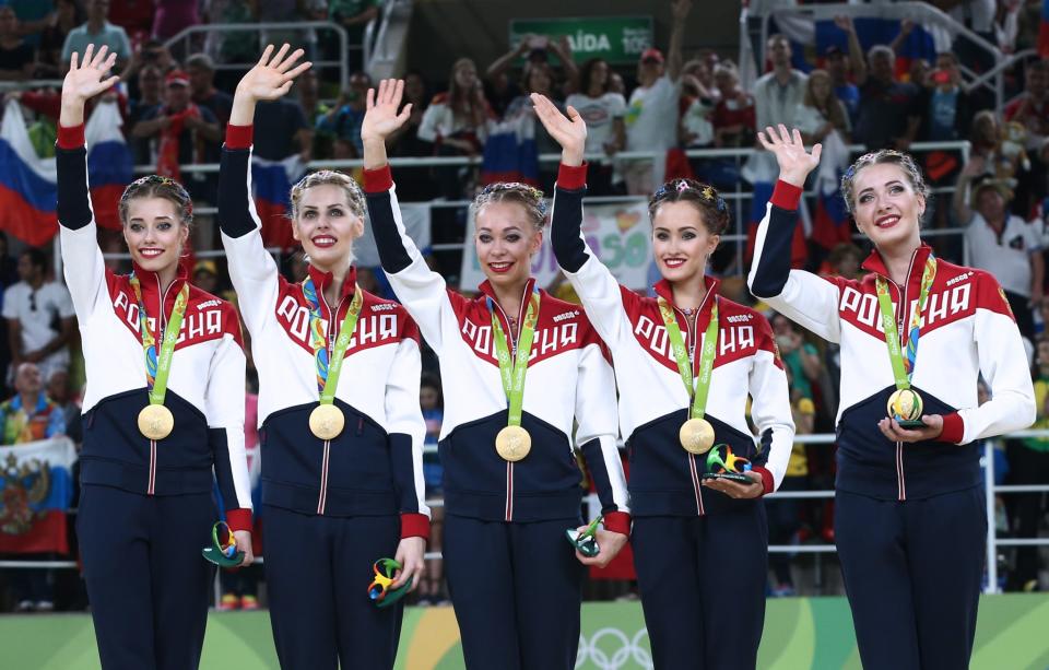 <p>The Russian gymnasts pose with their gold medals at an award ceremony for the rhythmic gymnastics group all-around final (Rotation 2) at Rio Olympic Arena at the 2016 Summer Olympic Games. (Getty) </p>