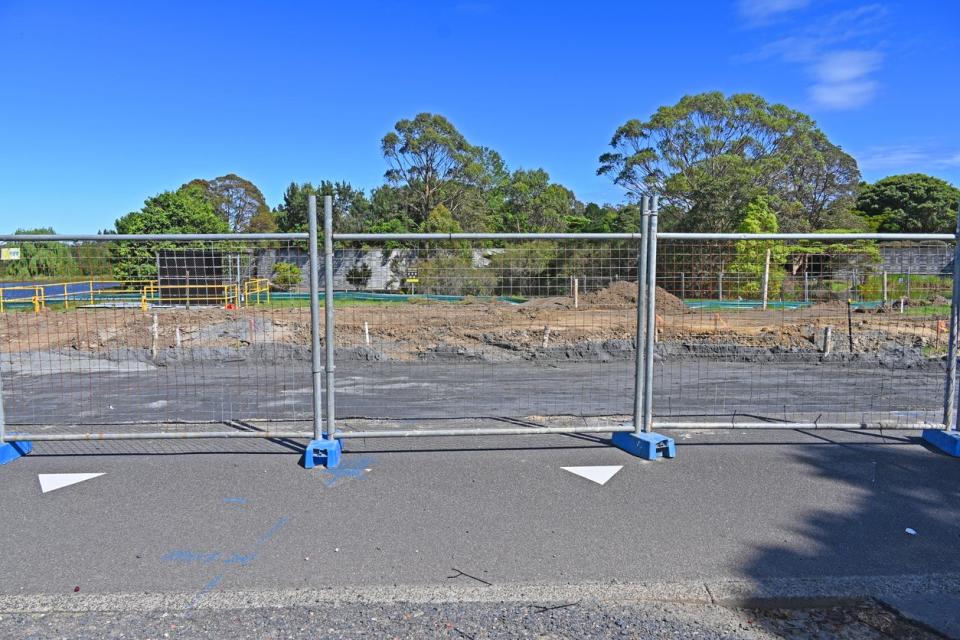 A view of a temporary metal fence. 