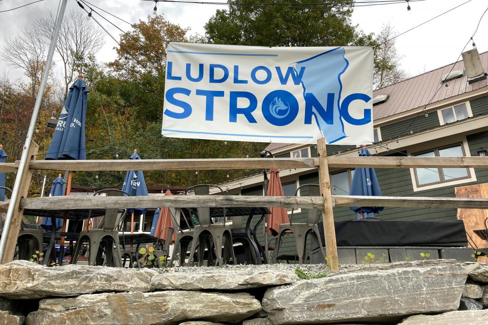 A "Ludlow Strong" sign hangs outside a restaurant, in Ludlow, Vermont, Thursday, Oct. 19, 2023, three months after severe flooding hit the ski town. As winter approaches and the fall tourism season lingers, Ludlow businesses that lost out on summer tourism want to get the word out that they are open, even though a handful are still in the throes of rebuilding.