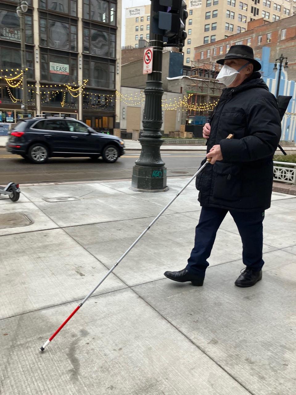 Stephen Handschu, 76, walks from his apartment to a Woodward Avenue bus stop where he will catch a ride to his martial arts class in Ferndale. He studies a mix of Filipino jujitsu, karate and stickwork that he then teaches to others with visual impairments.