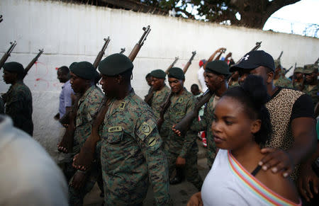 Residents accompany members of the Haitian Armed Forces (FAD'H) parade in the streets of Cap-Haitien, Haiti, November 18, 2017. REUTERS/Andres Martinez Casares