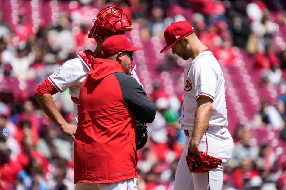 Reds meet at the mound during the Reds vs. Phillies game at Great American Ball Park on Thursday April 25, 2024. The Phillies won the game with a final score of 5-0.