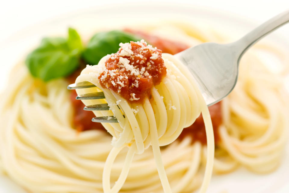 Spaghetti with tomato sauce as closeup on fork