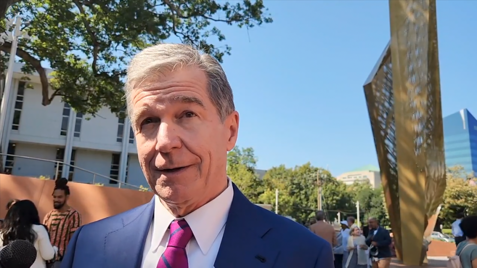 N.C. Democratic Gov. Roy Cooper talks with reporters after the opening ceremony of North Carolina Freedom Park in downtown Raleigh on Wednesday, Aug. 23, 2023.