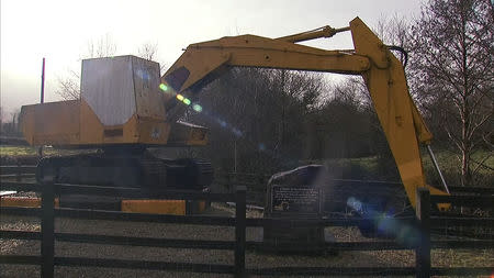 The 'border buster' JCB digger stands on the border near Kinawley in Northern Ireland and Swanlinbar in Ireland, in this still image taken from video on February 6, 2019. REUTERS/Reuters TV