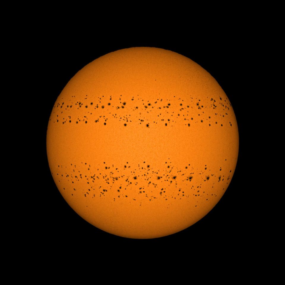 sun with black dots running across