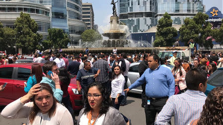 People react after an earthquake hit in Mexico City, Mexico September 19, 2017. REUTERS/Carlos Jasso