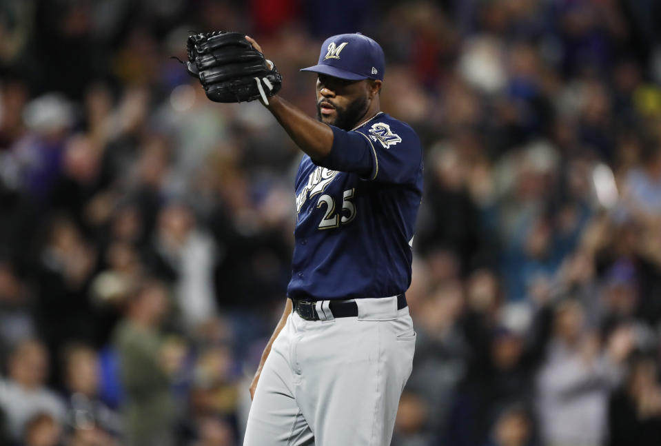 Milwaukee Brewers relief pitcher Jay Jackson calls for a new ball after giving up a grand slam to Colorado Rockies pinch hitter Raimel Tapia in the sixth inning of a baseball game Friday, Sept. 27, 2019, in Denver. (AP Photo/David Zalubowski)