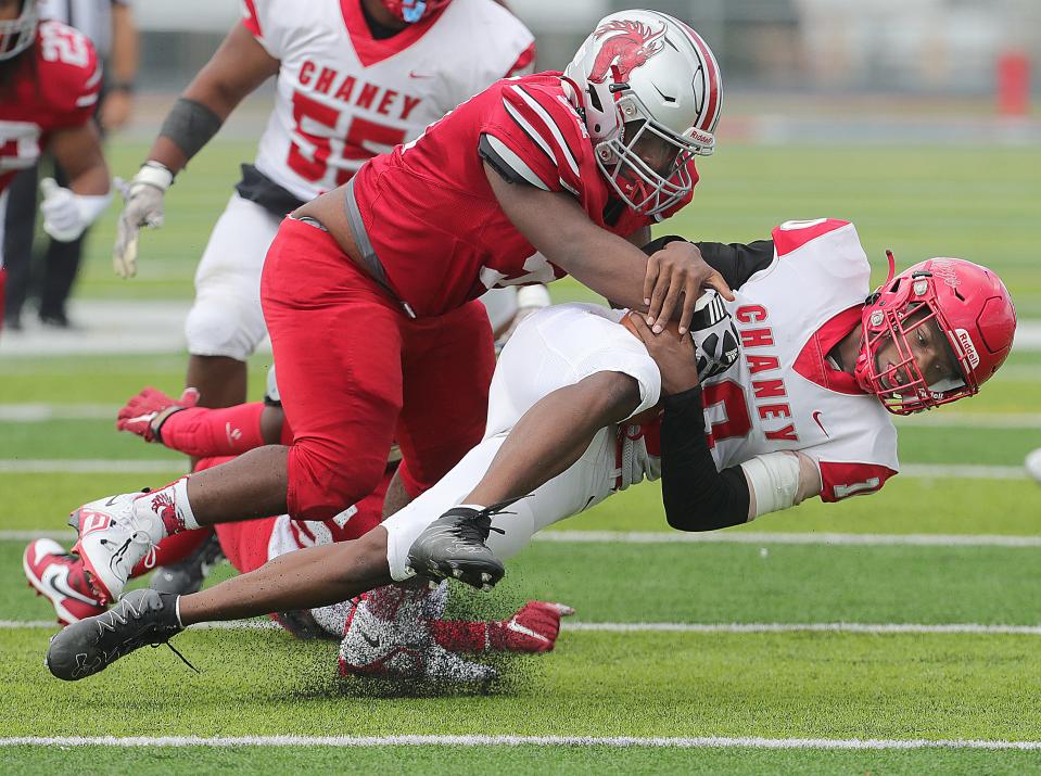 East's Cochise Griffin takes down Youngstown Chaney quarterback Matt Jones for a loss on Friday in Akron.