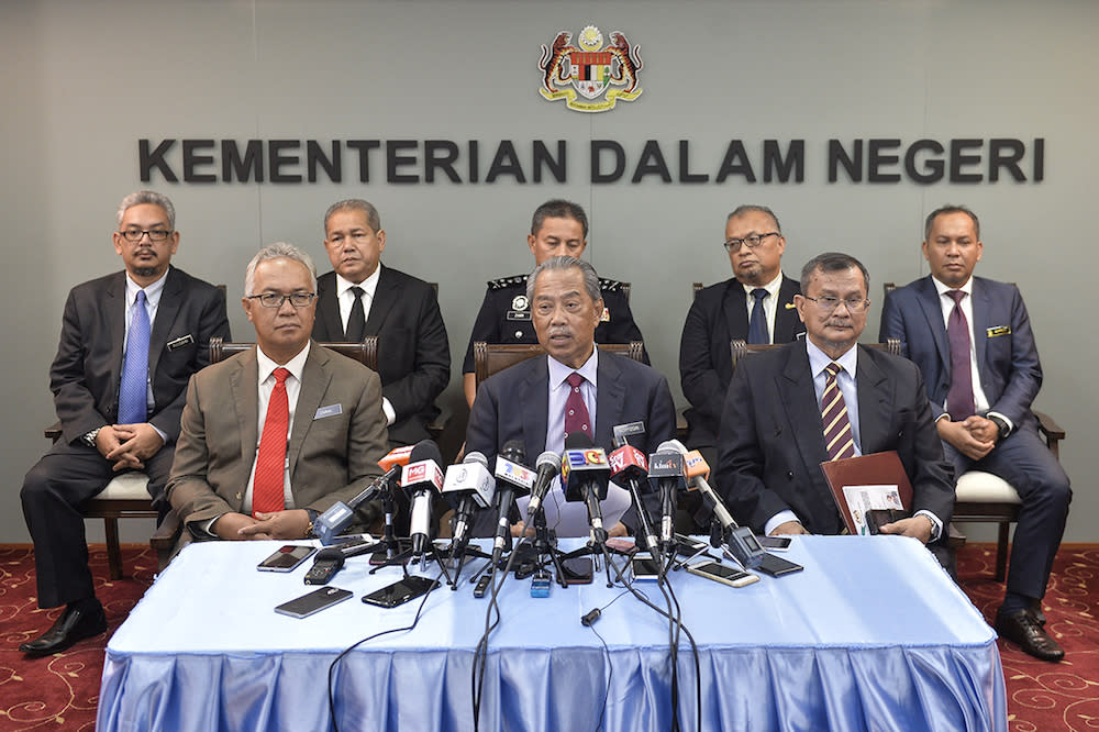 The special task force on the enforced disappearances of pastor Raymond Koh and Amri Che Mat poses for pictures in Putrajaya June 26, 2019. — Picture by Miera Zulyana