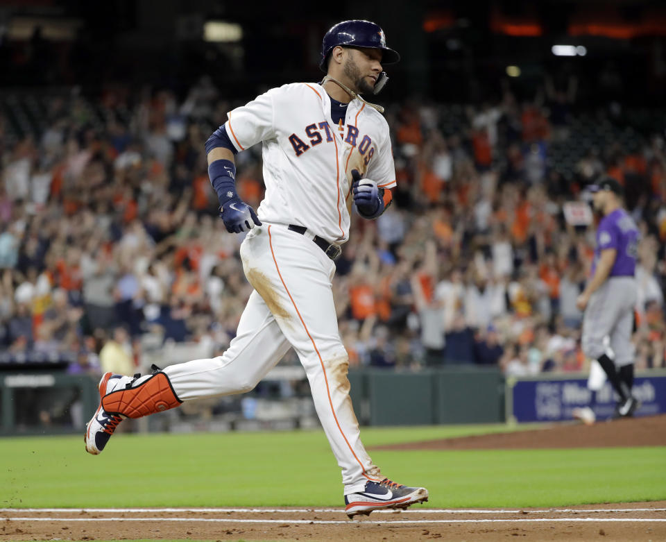 Houston Astros' Yuli Gurriel runs the bases after hitting a two-run home run against the Colorado Rockies during the second inning of a baseball game Wednesday, Aug. 15, 2018, in Houston. (AP Photo/David J. Phillip)