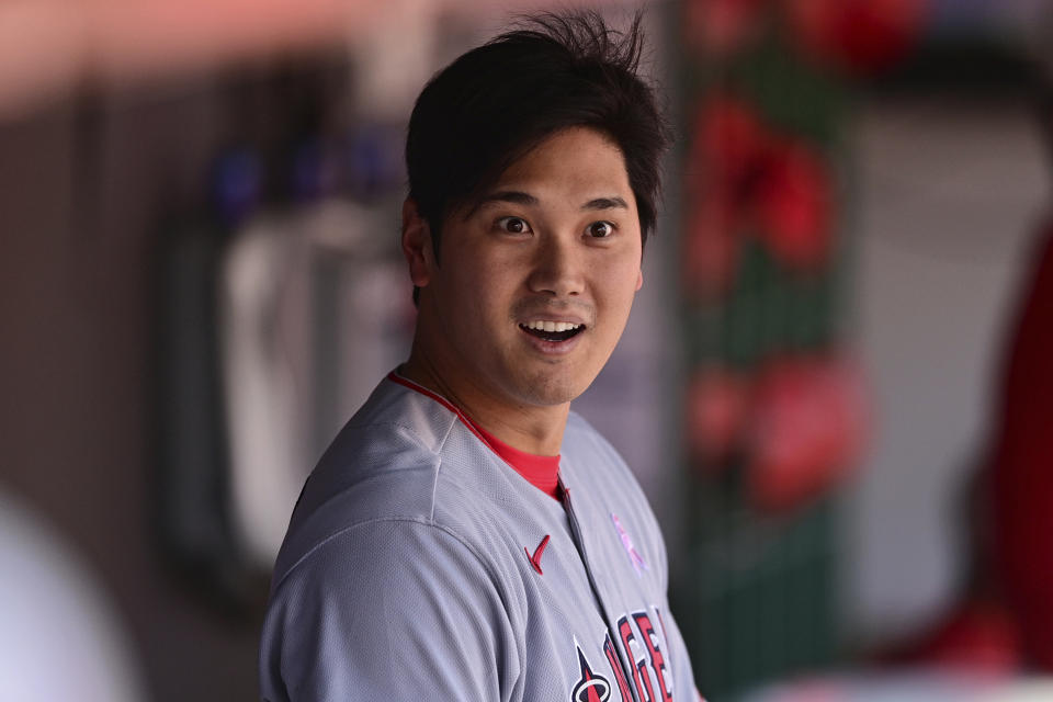 Los Angeles Angels' Shohei Ohtani reacts in the dugout after striking out during the fourth inning of a baseball game against the Cleveland Guardians, Sunday, May 14, 2023, in Cleveland. (AP Photo/David Dermer)