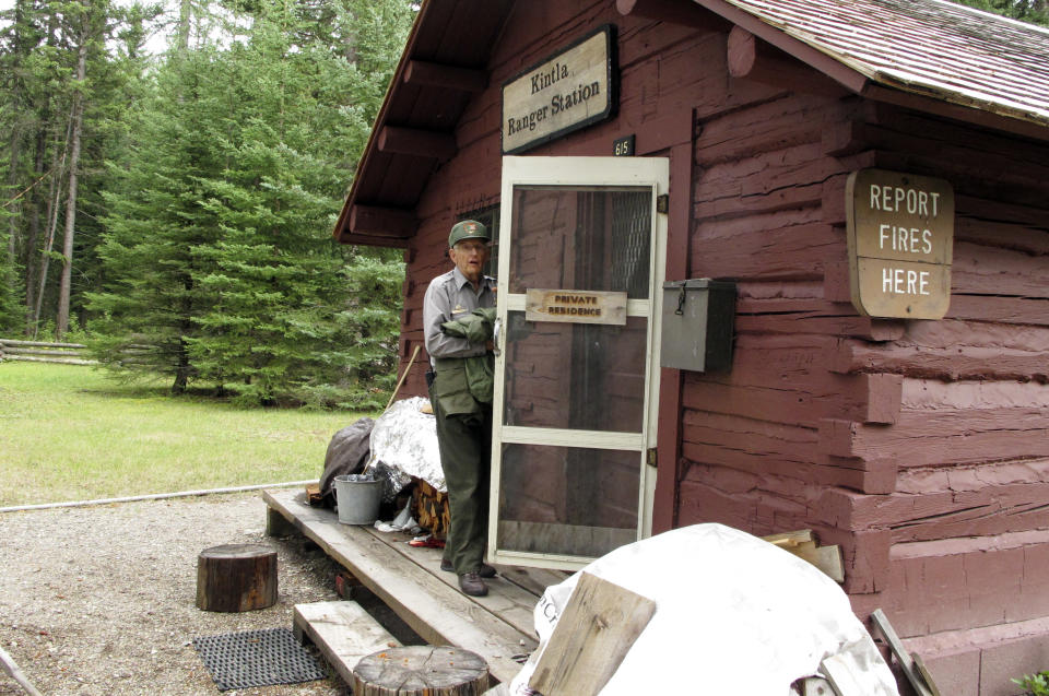 This Sept. 5, 2013 photo shows Lyle Ruterbories entering his cabin at Kintla Lake Campground in Glacier National Park, Mont. Ruterbories is the National Park Service's oldest ranger at age 93. He and his wife Marge managed the campground since 1991, and Ruterbories has continued on his own since she died in 2005. (AP Photo/Matt Volz)