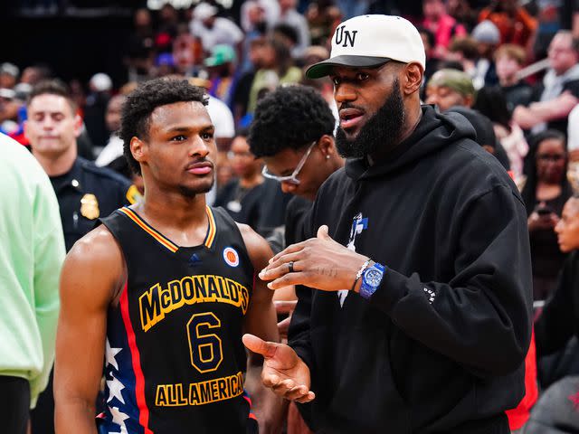 <p>Alex Bierens de Haan/Getty</p> Bronny James (left) and father LeBron James at the 2023 McDonald's High School Boys All-American Game.