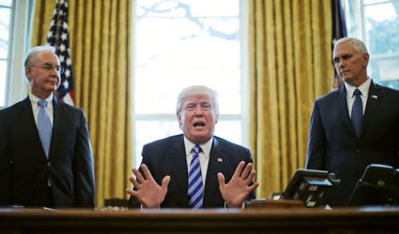 FILE PHOTO: President Trump reacts to the AHCA health care bill being pulled as he appears with HHS Secretary Price and Vice President Pence in the Oval Office