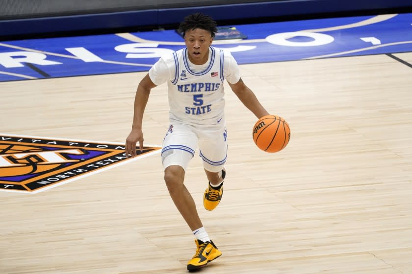 Memphis guard Boogie Ellis handles the ball during an NCAA college basketball championship game against Mississippi State in the NIT, Sunday, March 28, 2021, in Frisco, Texas. (AP Photo/Tony Gutierrez)