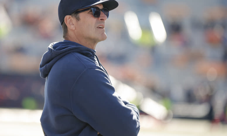 Michigan football head coach Jim Harbaugh coaching against Illinois.