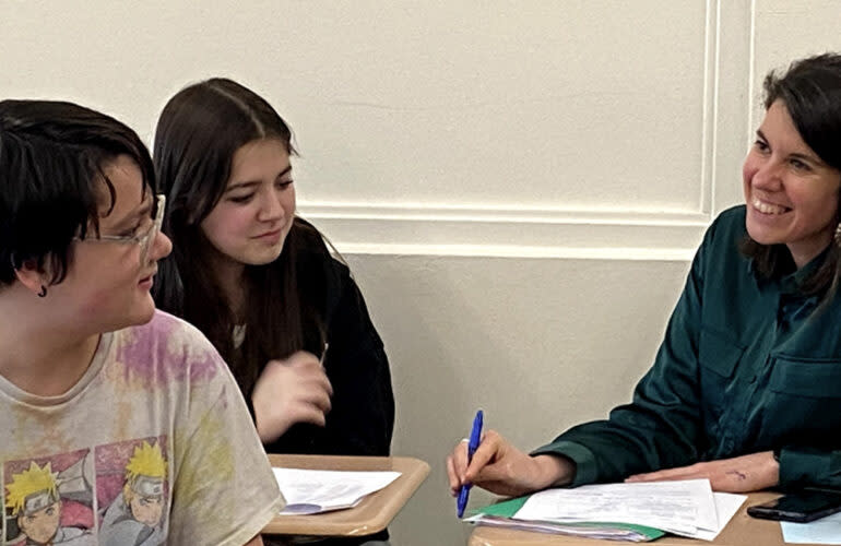 Illinois Teacher of the Year Kimberly Radostits worked with two students on homework in her Spanish class. (Heidi Deininger)