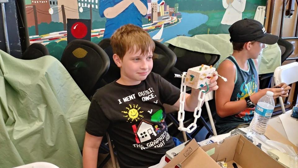 Jason Dale of Anderson holds up the "robot" sculpture he made during the Shasta County Arts Council's art day camp in 2019. The program was on hold for two years in 2020 and 2021.