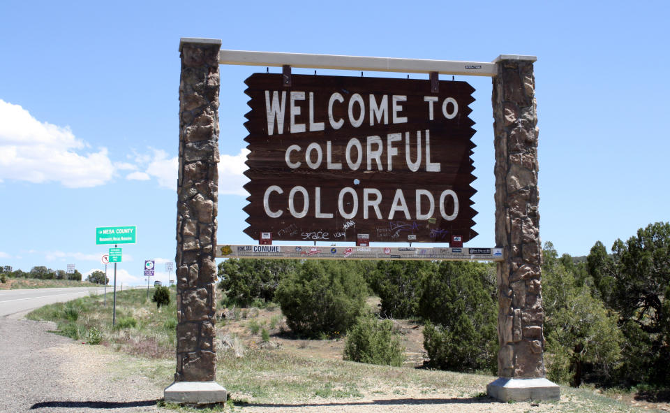 Welcome sign reading "Welcome to Colorful Colorado" at a state border