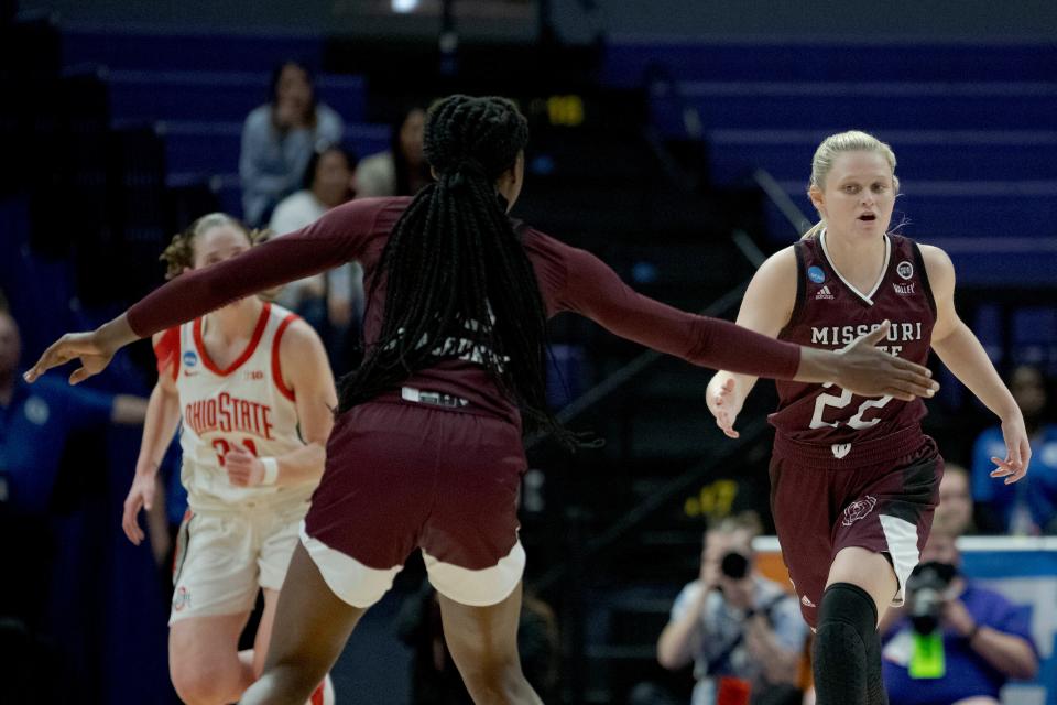 Missouri State guard Paige Rocca (22), right, celebrates a score with forward Ifunanya Nwachukwu (13) against Ohio State in the first half of a women's college basketball game in the first round of the NCAA tournament, Saturday, March 19, 2022, in Baton Rouge, La. (AP Photo/Matthew Hinton)