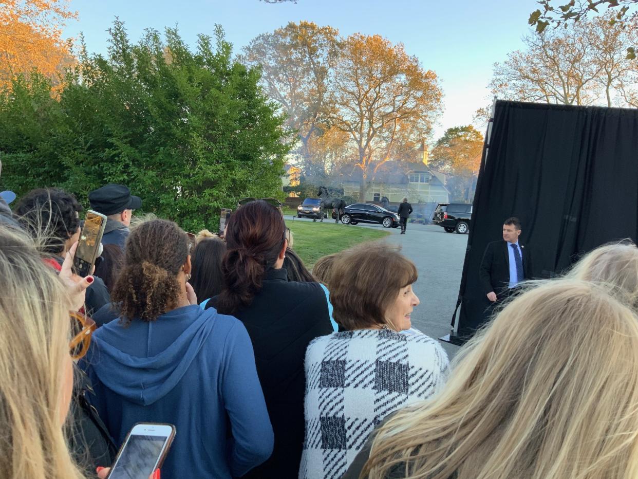 People gathered outside Belcourt Castle in Newport try to catch a glimpse of the celebrities attending Jennifer Lawrence's wedding on Saturday. (SEAN FLYNN/DAILY NEWS PHOTO)