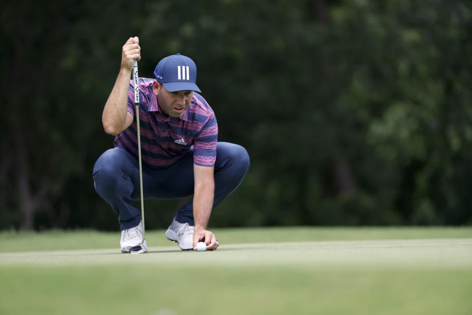 Sergio Garcia, of Spain, lines up his putt on the fifth green during the third round of the Charles Schwab Challenge golf tournament at the Colonial Country Club in Fort Worth, Texas, Saturday May 29, 2021. (AP Photo/Ron Jenkins)