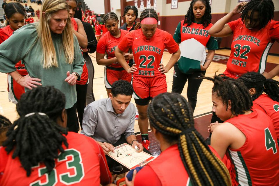 Lawrence North Coach Stephen Thomas maps out plays as the Lawrence North Wildcats take on the Warren Central Warriors during the IHSAA Class 4A Girls Basketball Sectional Championship, February 4, 2023, at Lawrence Central High School.