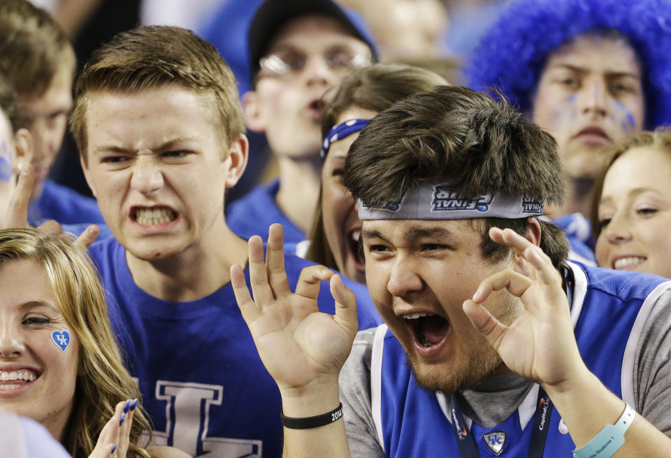 Kentucky fans cheer before their game against Wisconsin at their NCAA Final Four tournament college basketball semifinal game Saturday, April 5, 2014, in Arlington, Texas. (AP Photo/David J. Phillip)