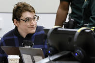 Marjory Stoneman Douglas High School shooter Nikolas Cruz smiles as he sits down at the defense table during the penalty phase of his trial at the Broward County Courthouse in Fort Lauderdale on Monday, Oct. 3, 2022. Cruz previously plead guilty to all 17 counts of premeditated murder and 17 counts of attempted murder in the 2018 shootings. (Amy Beth Bennett/South Florida Sun Sentinel via AP, Pool)