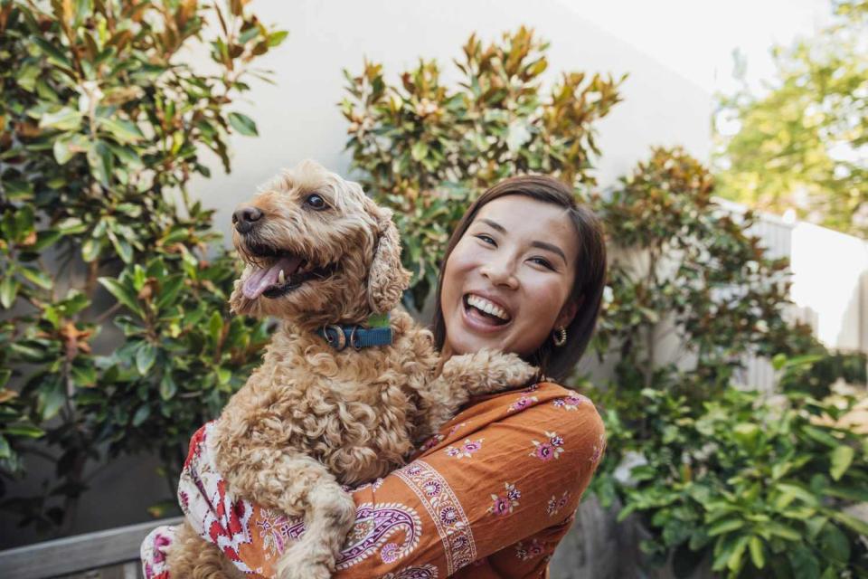 woman holding pet