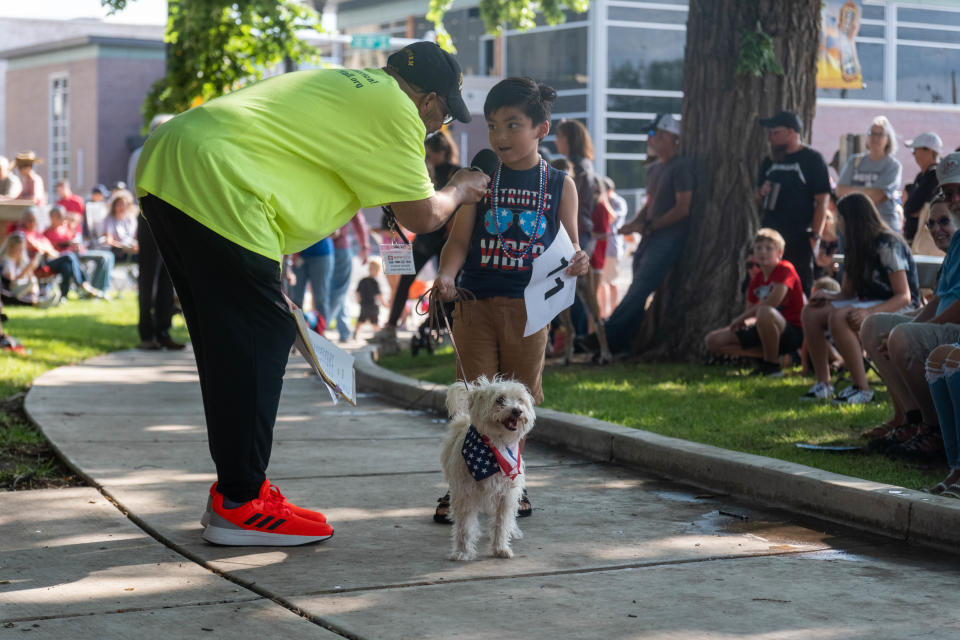 Young Liam Sirmanodham tries to talk up his dog Oscar at Center City's 3rd annual Patriotic Pet Parade Saturday at the Amarillo Community Market in downtown Amarillo.