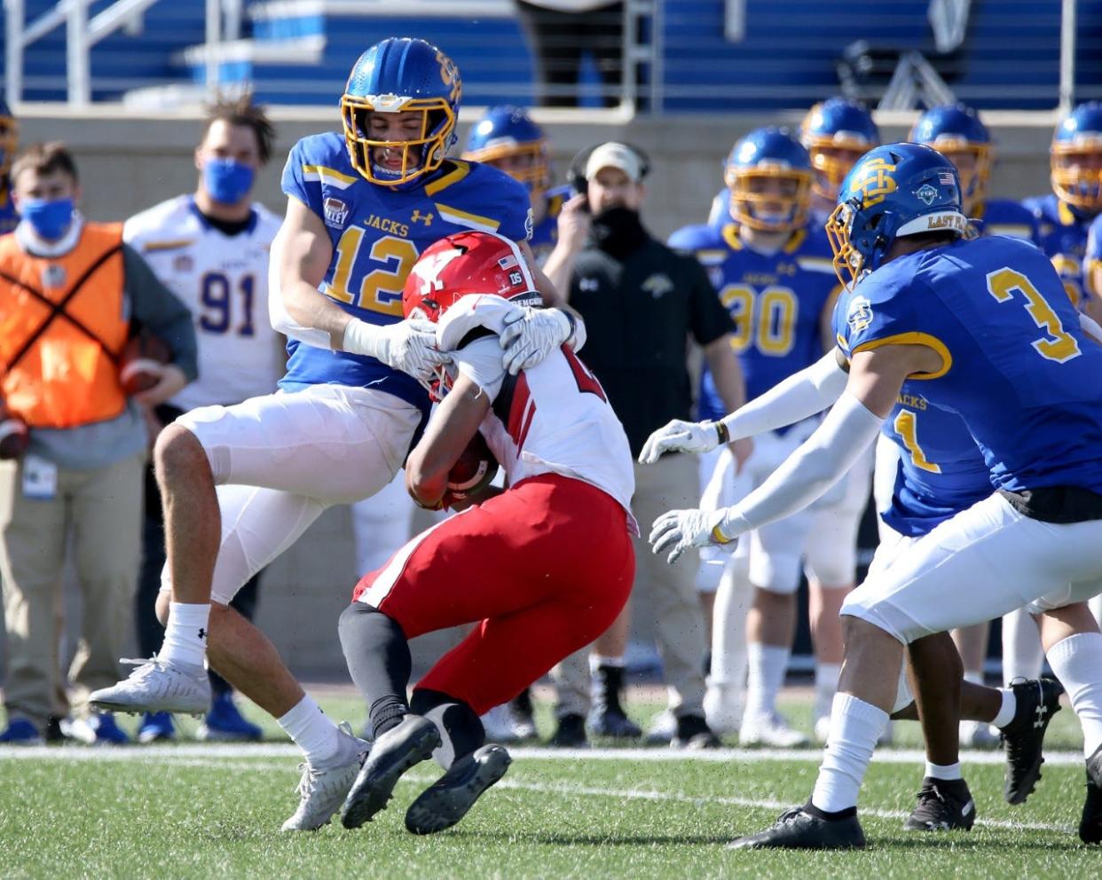 SDSU's Logan Backhaus makes a tackle Saturday at Dana J. Dykhouse Stadium.