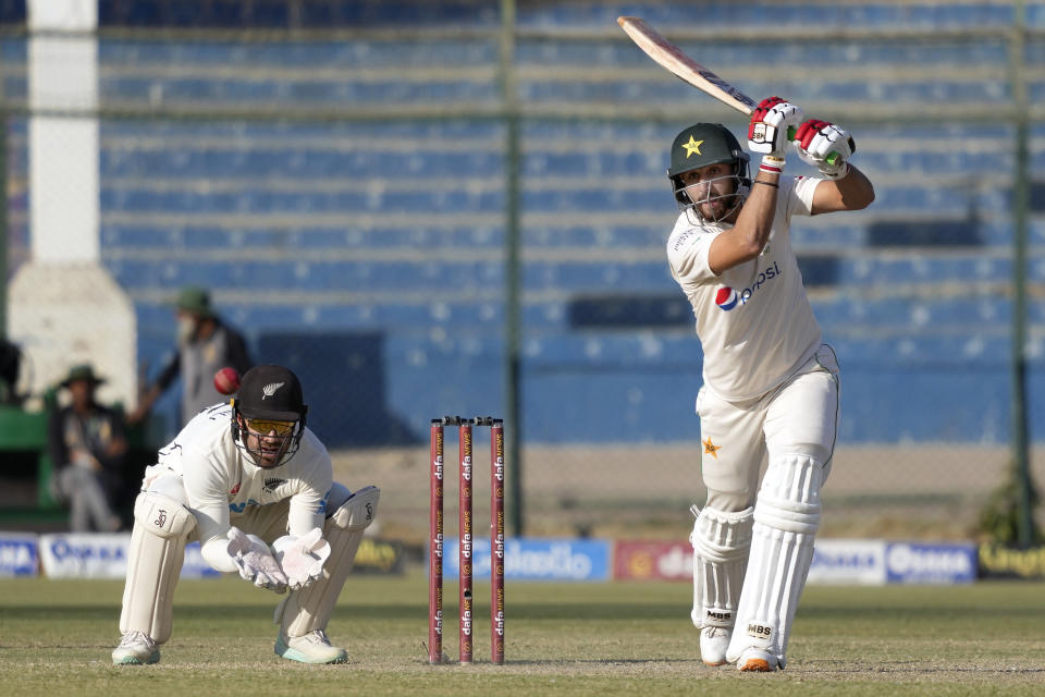 Pakistan's Agha Salman, right, plays a shot as New Zealand's Tom Blundell watches during the third day of the second test cricket match between Pakistan and New Zealand, in Karachi, Pakistan, Wednesday, Jan. 4, 2023. (AP Photo/Fareed Khan)