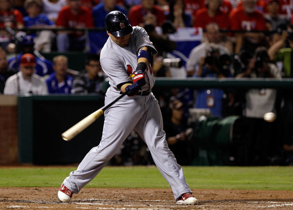 ARLINGTON, TX - OCTOBER 24: Yadier Molina #4 of the St. Louis Cardinals hits an RBI single in the second inning during Game Five of the MLB World Series against the Texas Rangers at Rangers Ballpark in Arlington on October 24, 2011 in Arlington, Texas. (Photo by Rob Carr/Getty Images)