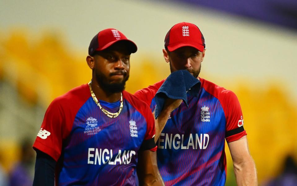 Chris Jordan and Chris Woakes of England look dejected following the ICC Men&#39;s T20 World Cup semi-final match between England and New Zealand at Sheikh Zayed stadium on November 10, 2021 in Abu Dhabi, United Arab Emirates - Getty Images Sport 