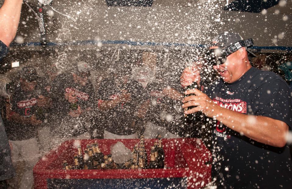 Cleveland, including manager Terry Francona (right), celebrates winning the American League Central Division after defeating Kansas City 3-2 in Cleveland, Sunday, Sept. 17, 2017.