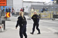 Police attend the scene after a truck crashed into a department store injuring several people in central Stockholm, Sweden, Friday April 7, 2017. (Noella Johansson, TT News Agency via AP)