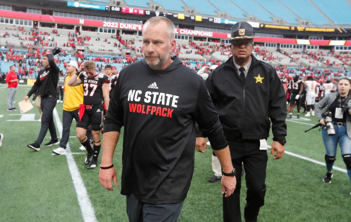 N.C. State head coach Dave Doeren walks off the field after Maryland’s 16-12 victory over N.C. State in the Duke’s Mayo Bowl at Bank of America Stadium in Charlotte, N.C., Friday, Dec. 30, 2022.