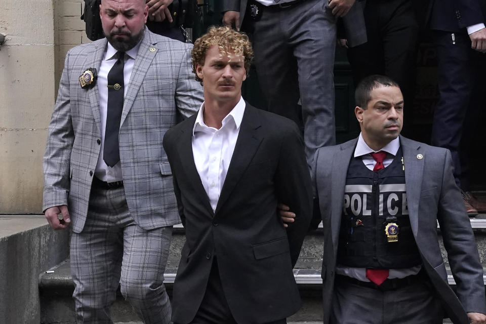 Daniel Penny is walked out of a New York Police Department precinct in Lower Manhattan on his way to be arraigned after he surrendered to authorities in the chokehold death of Jordan Neely. / Credit: Timothy A. Clary/AFP via Getty Images