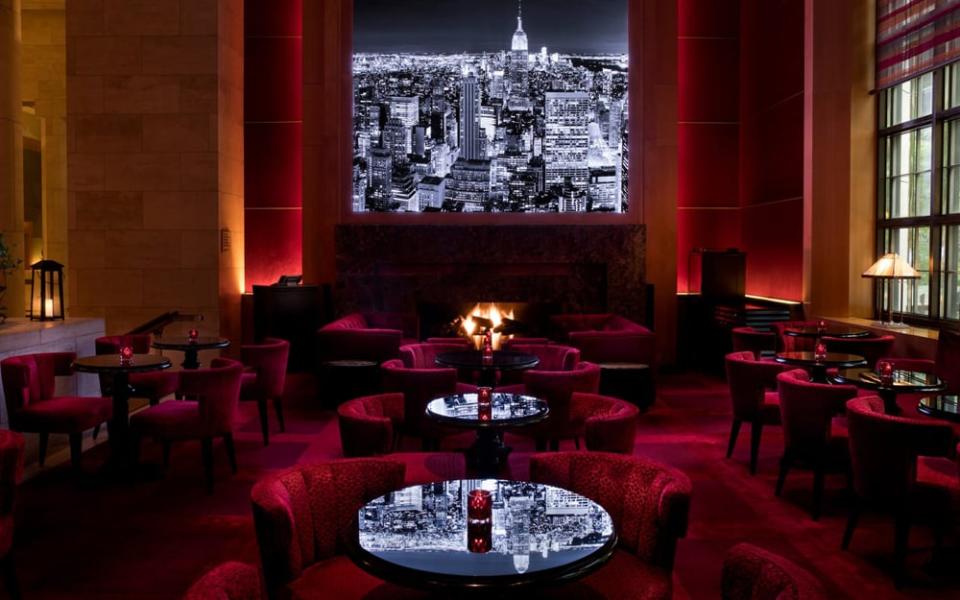 The Four Seasons Hotel New York is palatial but cosy furnishings and hum from the bar helps retain a degree of intimacy