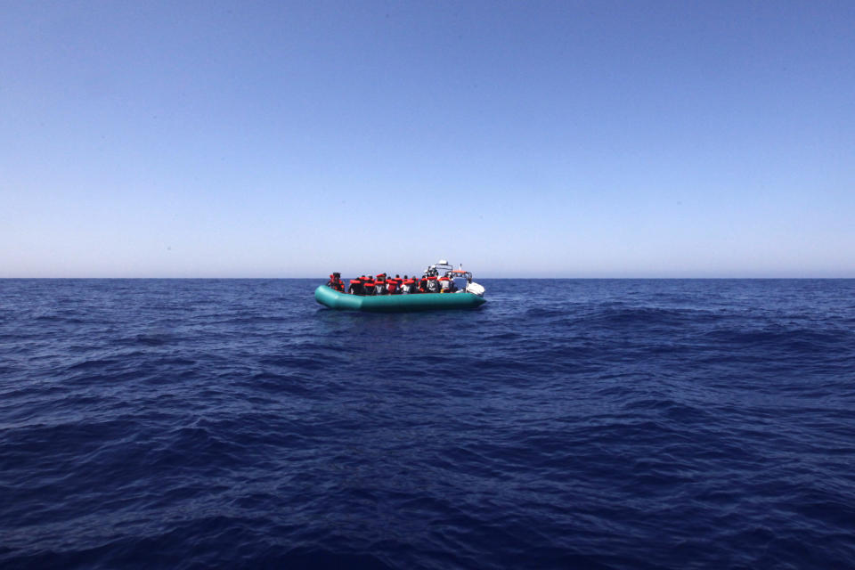 African migrants on a rubber boat in the Mediterranean Sea, off Libya are rescued by the MV Geo Barents vessel of MSF (Doctors Without Borders), in the central Mediterranean route, Monday, Sept. 20, 2021. (AP Photo/Ahmed Hatem)