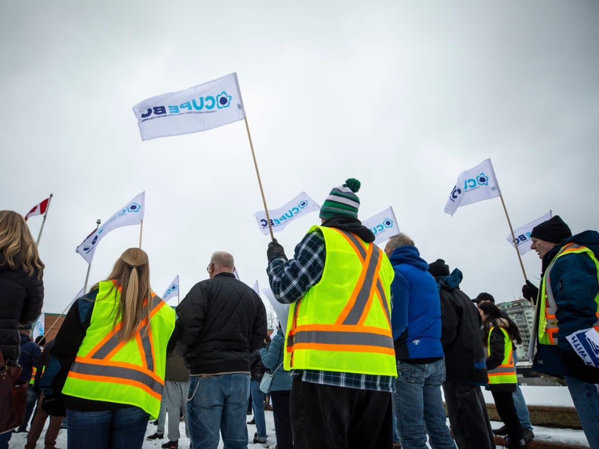 Fraser Valley Transit workers gather outside of Abbotsford City Hall during their strike in Abbotsford, B.C., on Feb. 27, 2023. (Ben Nelms/CBC - image credit)